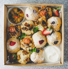 A box of mixed savoury and sweet mini muffins served with relish and sour cream. Vegan and nut free.